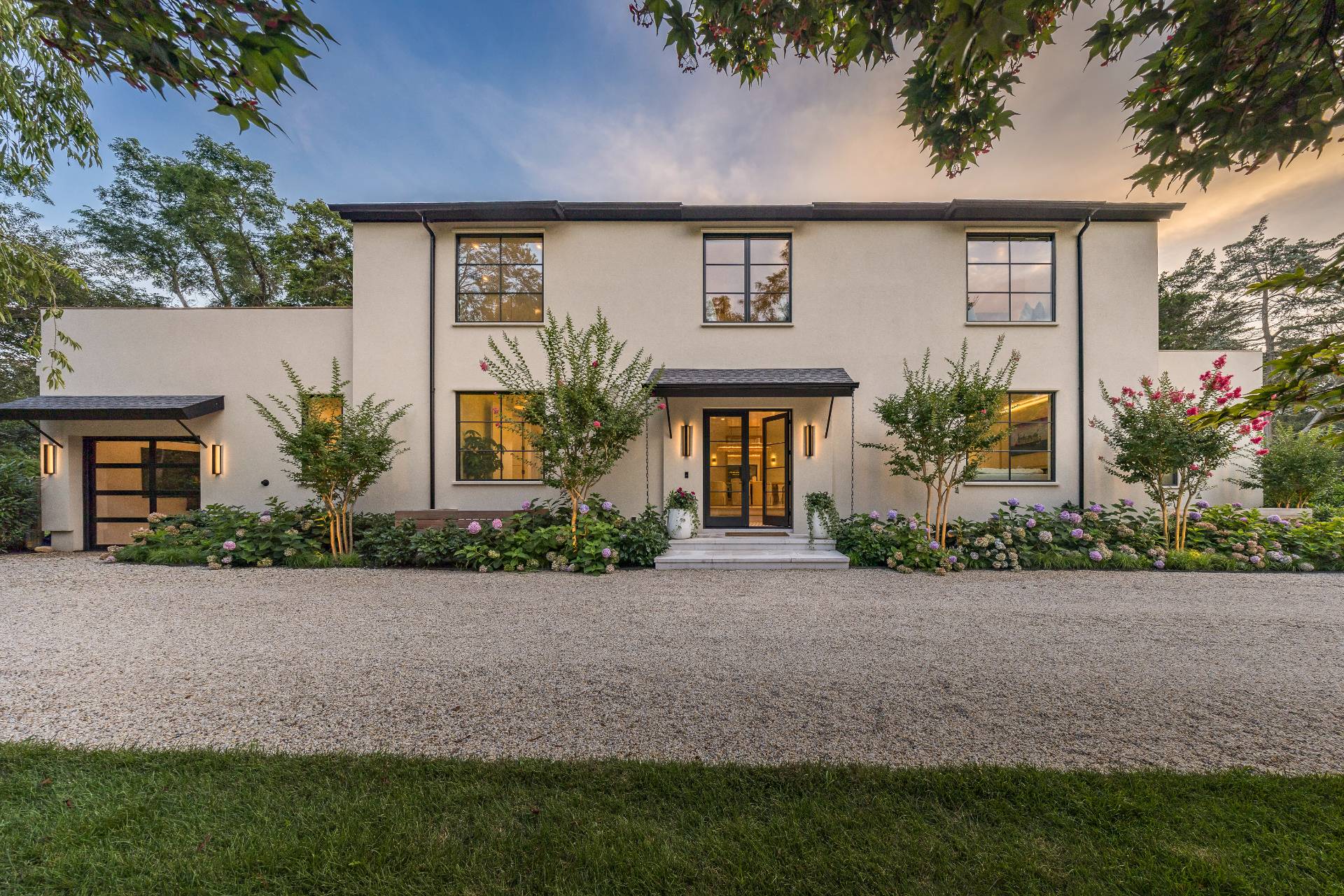 4 3rd Street Sag Harbor, NY 11963 - Photo 2 of 46 a front view of a house with garden