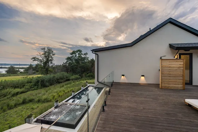 a view of balcony with furniture and wooden floor