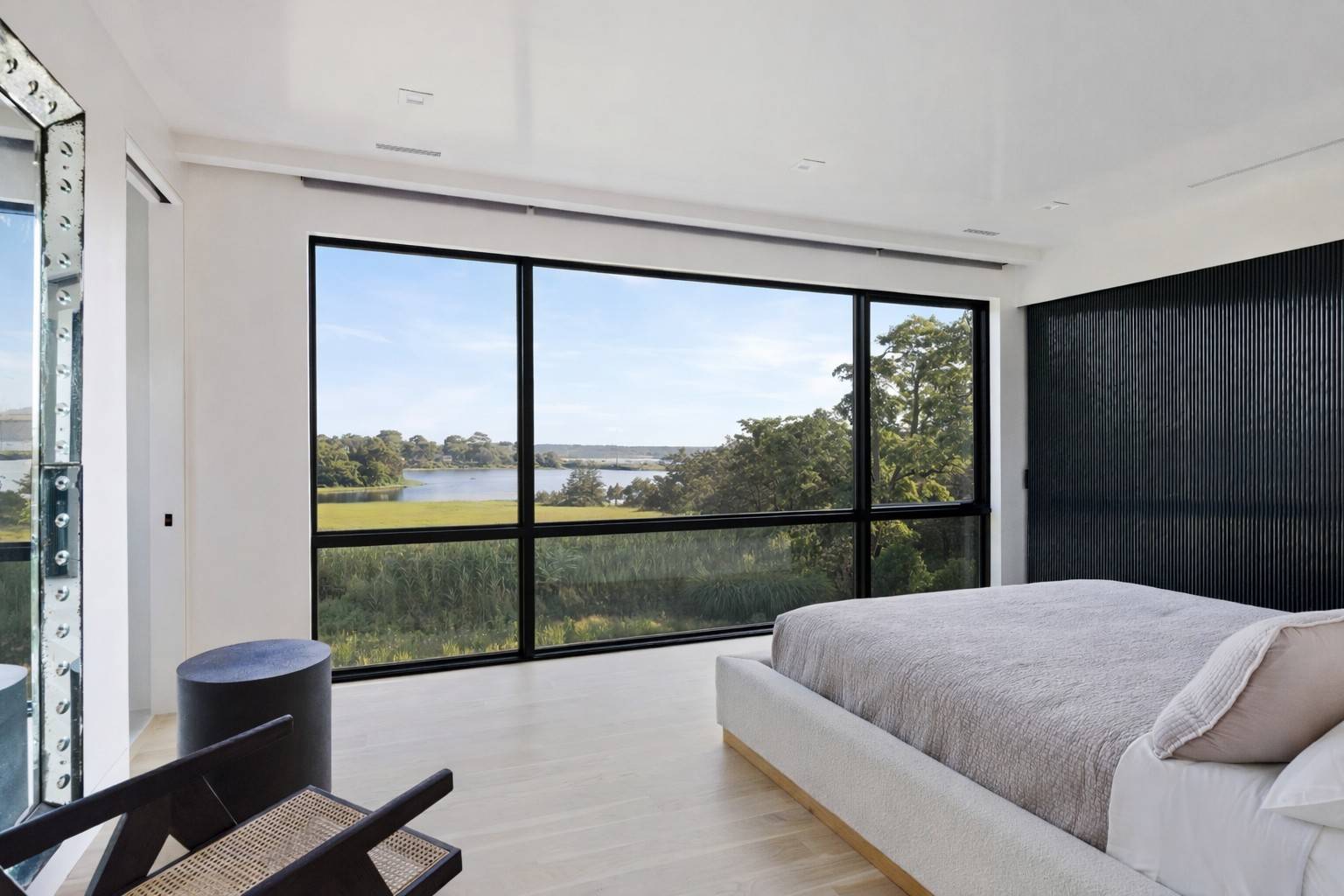 4 3rd Street Sag Harbor, NY 11963 - Photo 25 of 46 a bed sitting in a bedroom next to a window