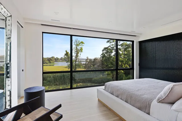 a bathroom with a granite countertop shower and a sink