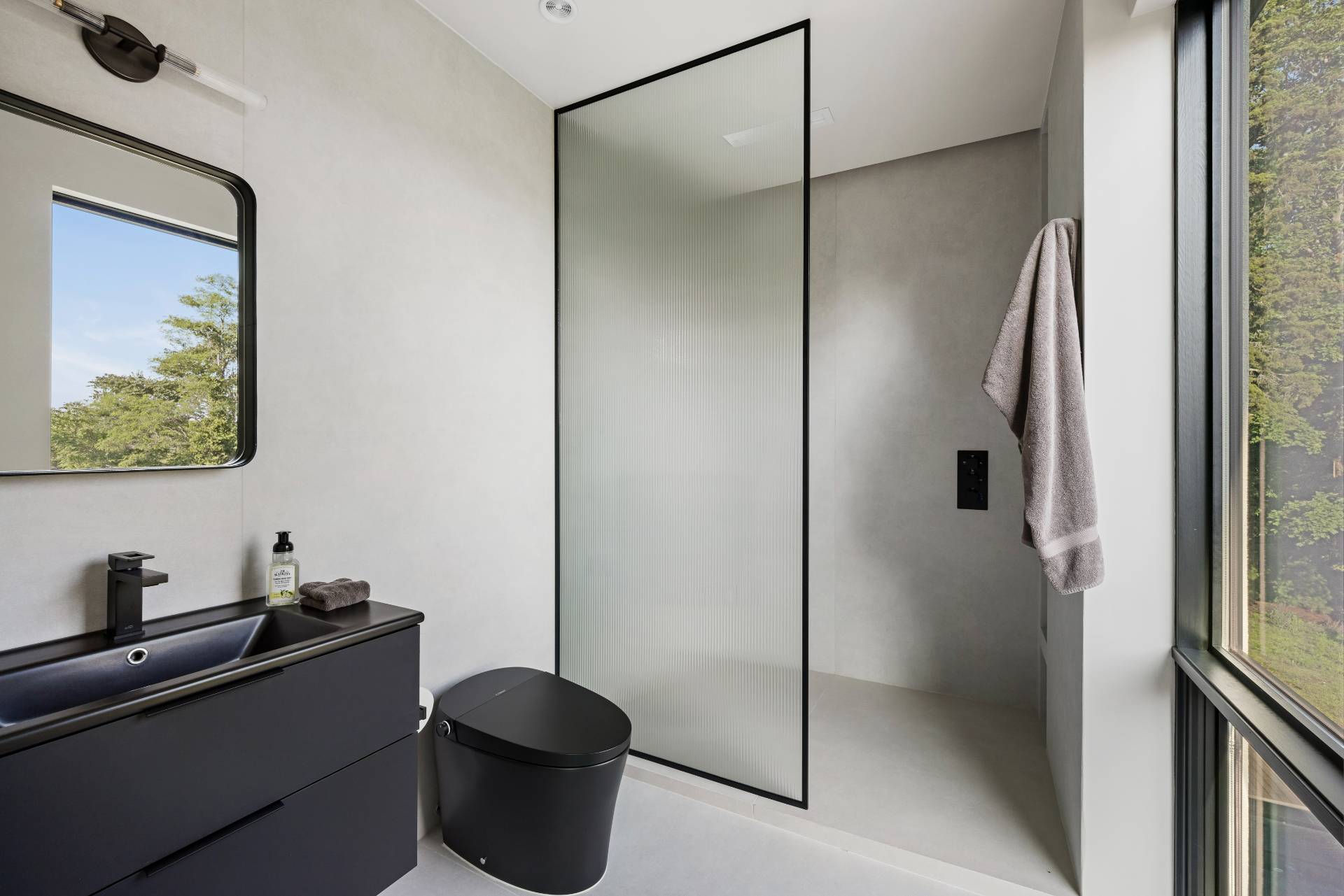 4 3rd Street Sag Harbor, NY 11963 - Photo 26 of 46 a bathroom with a granite countertop shower and a sink