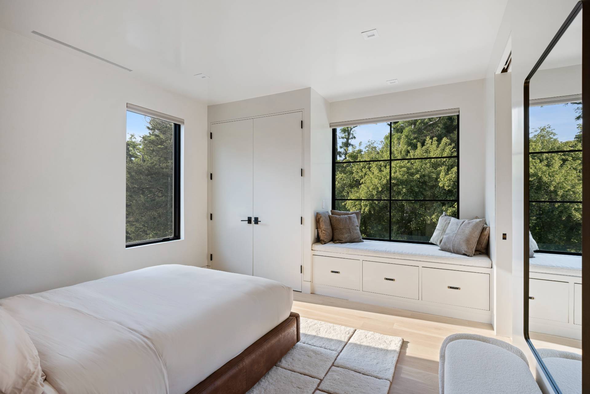 4 3rd Street Sag Harbor, NY 11963 - Photo 27 of 46 a bedroom with a bed and a window