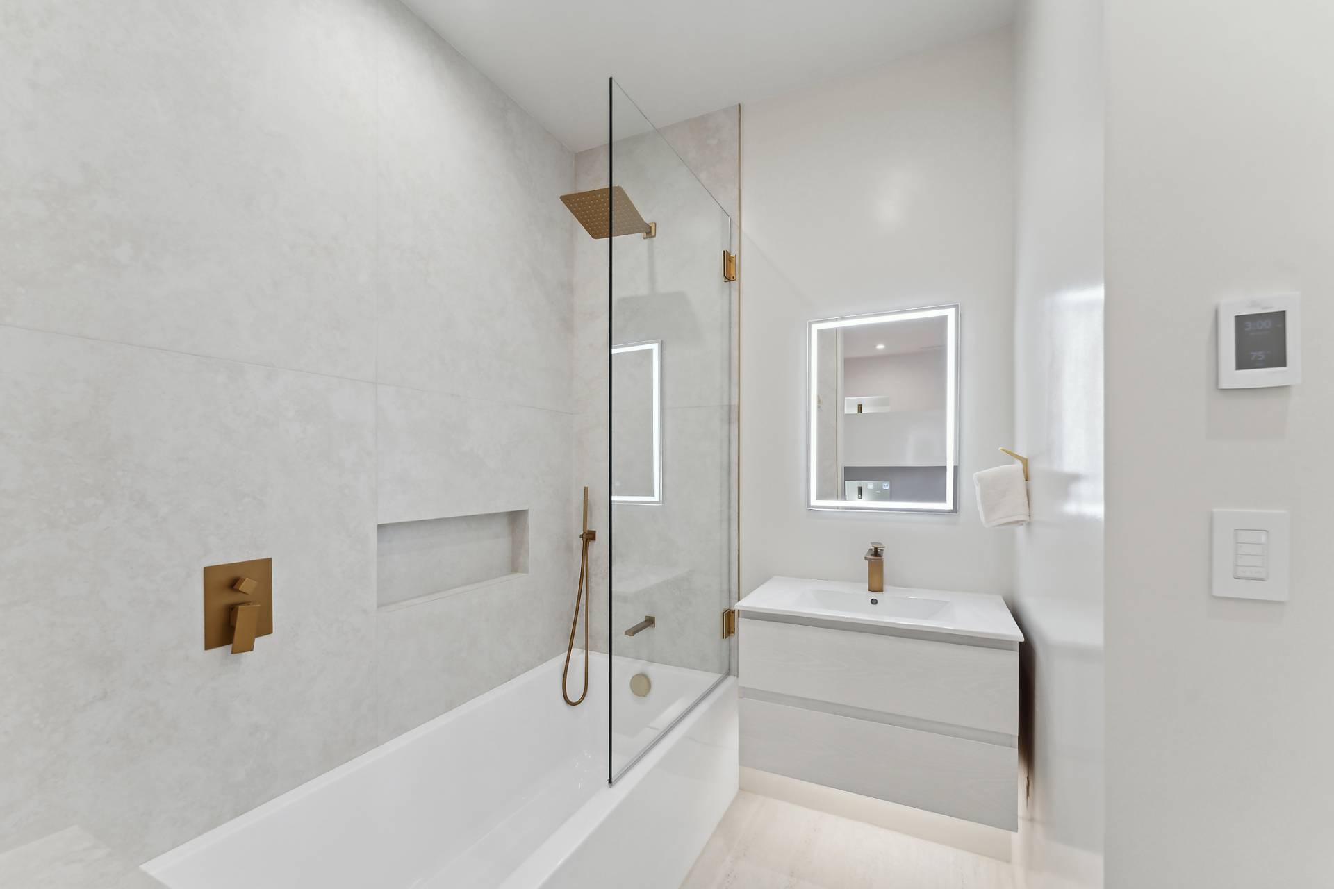 4 3rd Street Sag Harbor, NY 11963 - Photo 28 of 46 a bathroom with a bathtub and a sink