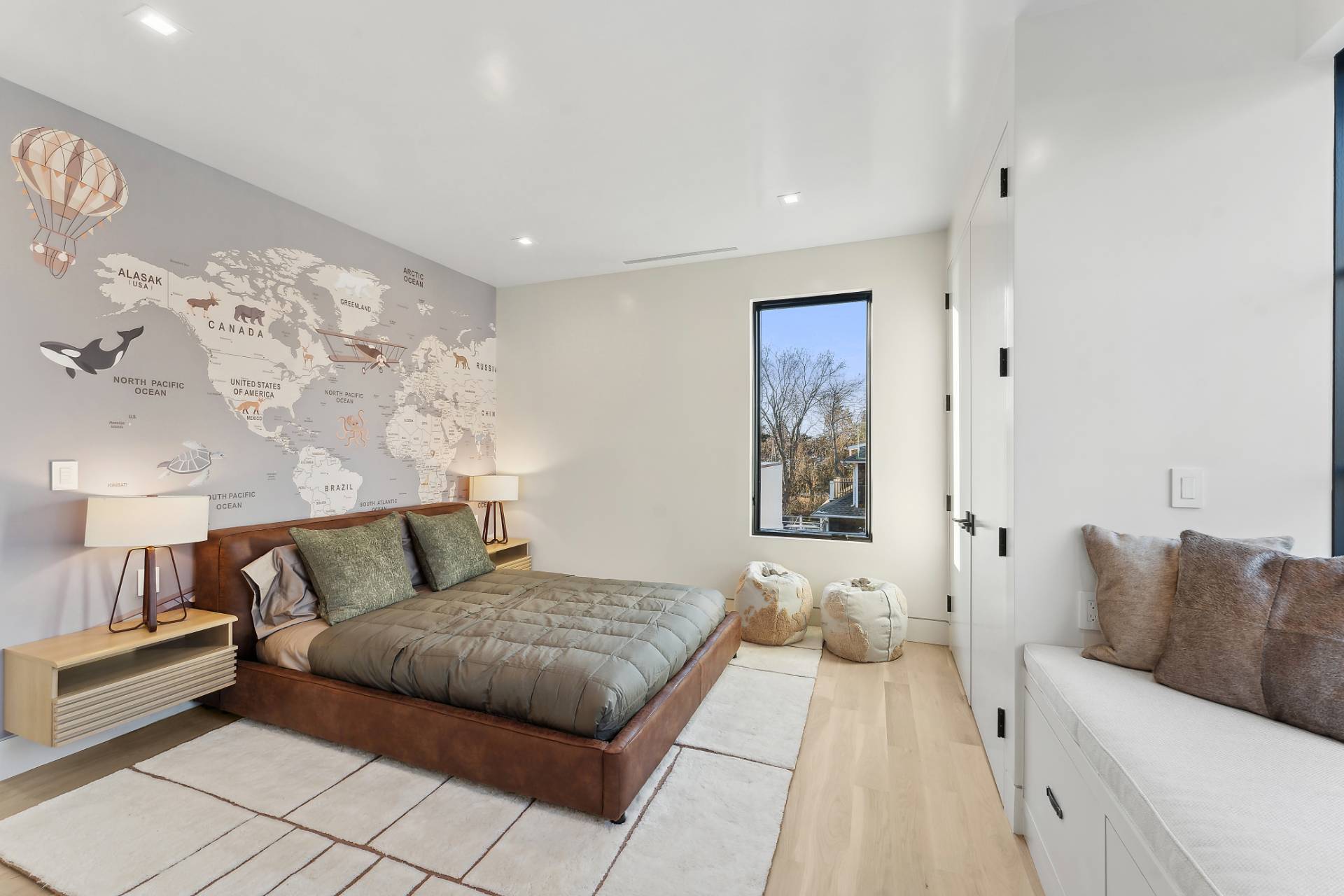 4 3rd Street Sag Harbor, NY 11963 - Photo 29 of 46 a bedroom with a large bed and a couch