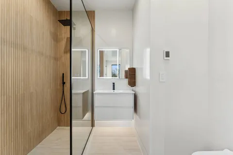 a large white bed in a white room