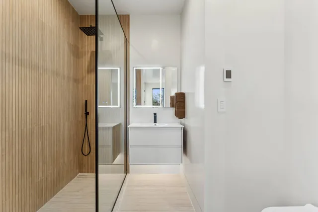 a large white bed in a white room