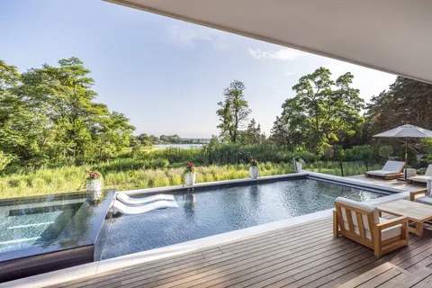 a view of a living room and a balcony