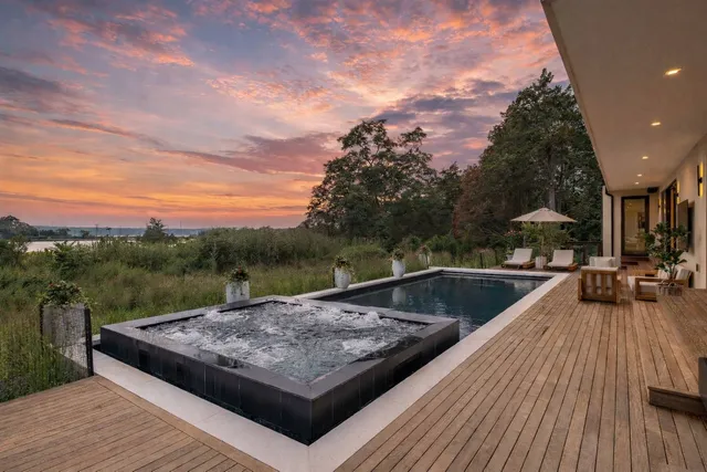 a view of a house with a yard and garage