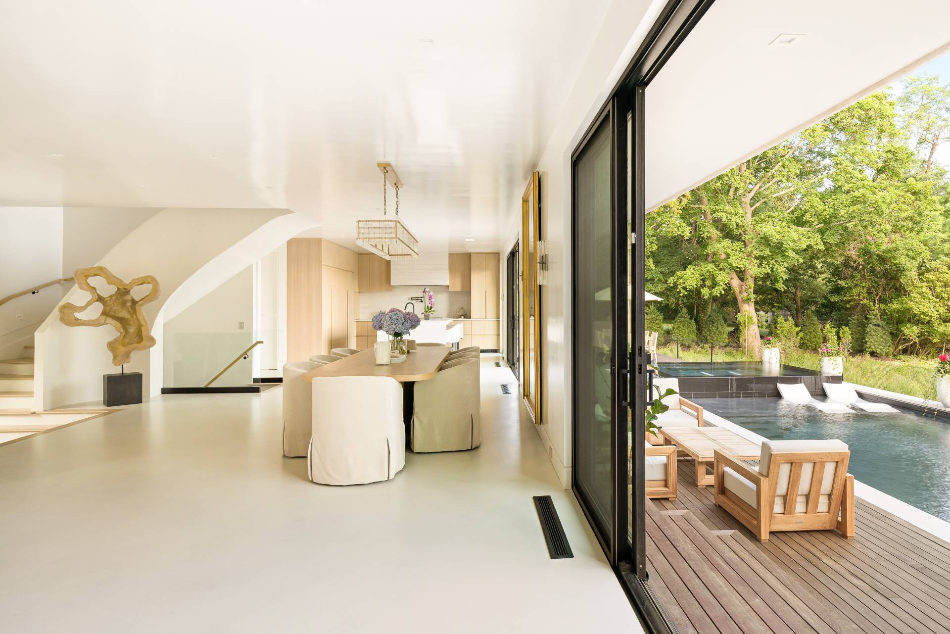 4 3rd Street Sag Harbor, NY 11963 - Photo 9 of 46 a view of a living room and kitchen with a large window