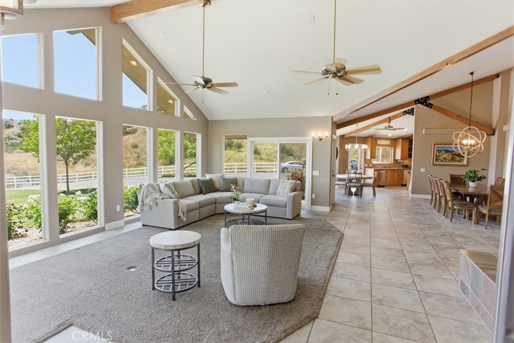 31233 Romero Canyon Road Castaic, CA 91384 - Photo 9 of 38 a living room with furniture and a large window