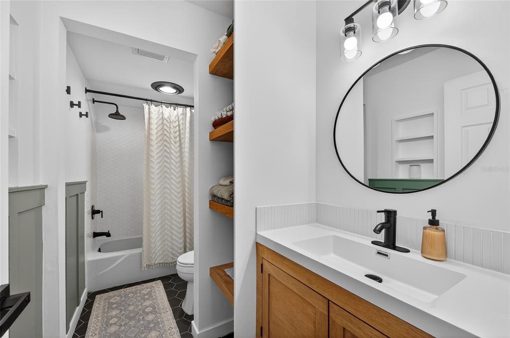 532 Center Road Venice, FL 34285 - Photo 33 of 68 a bathroom with a sink and a mirror
