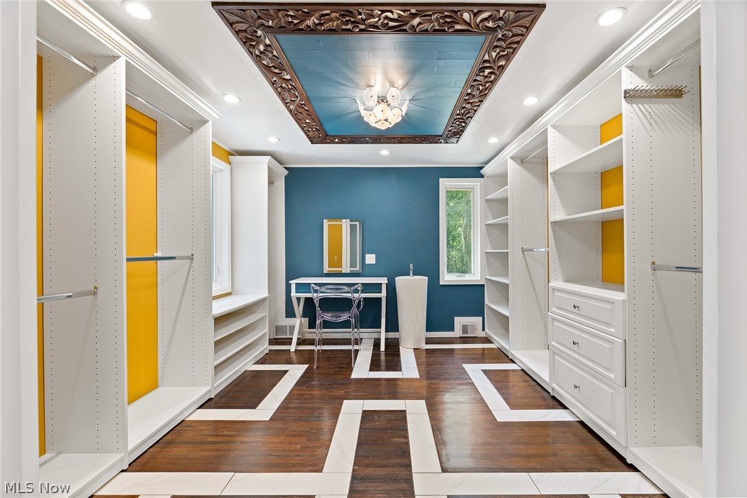 1375 North Revere Road Akron, OH 44333 - Photo 26 of 50 Custom built-in storage, recessed lighting, wood-finish flooring with accent tiles, and a decorative ceiling fixture
