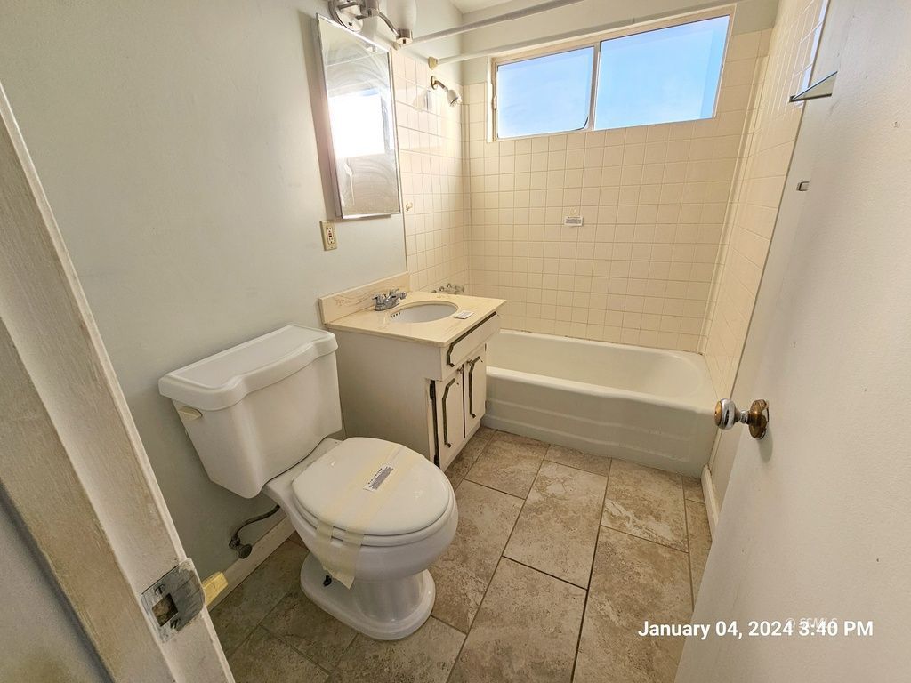 439 West Reeves Avenue Ridgecrest, CA 93555 - Photo 9 of 20 a white toilet sitting next to a bathroom sink
