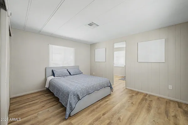 a bedroom with a bed and a window