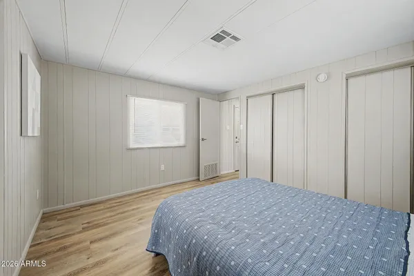 a bathroom with a sink a toilet and vanity
