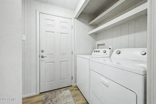 a view of a balcony with chairs and a table