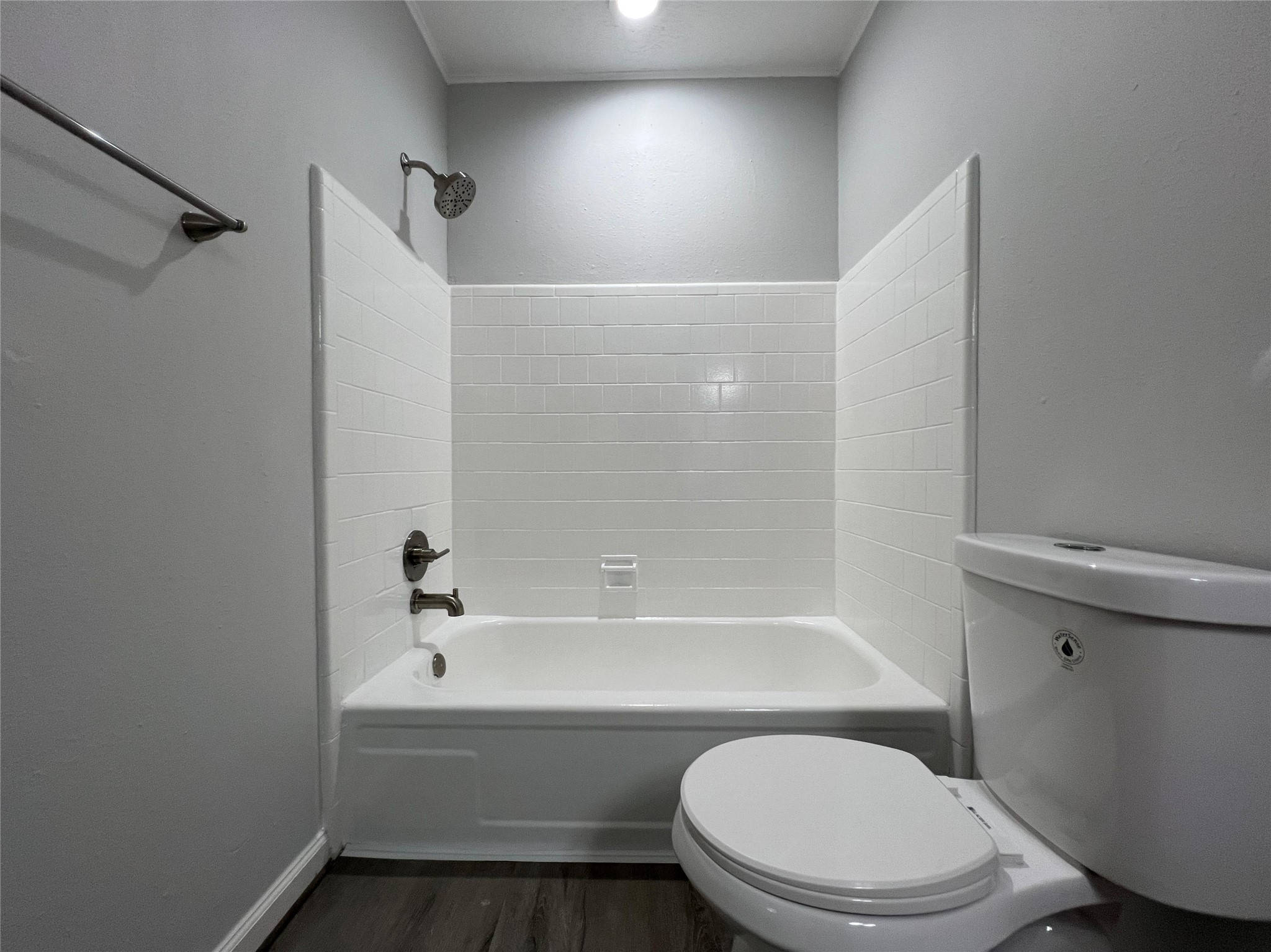 7012 Jetty Lane Houston, TX 77072 - Photo 17 of 24 a bathroom with a toilet and a bathtub