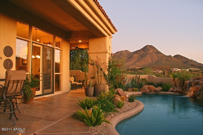 11059 East Turnberry Road Scottsdale, AZ 85255 - Photo 11 of 35 a terrace of a house with outdoor seating