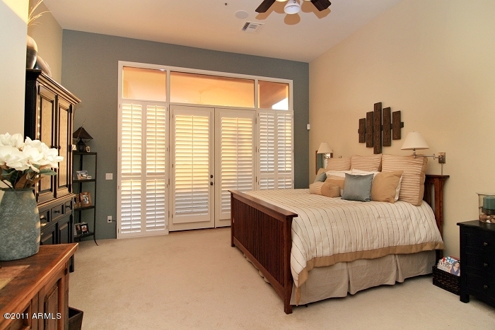 11059 East Turnberry Road Scottsdale, AZ 85255 - Photo 21 of 35 a bedroom with a bed and a window