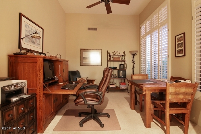 11059 East Turnberry Road Scottsdale, AZ 85255 - Photo 23 of 35 a view of a workspace with furniture and a window