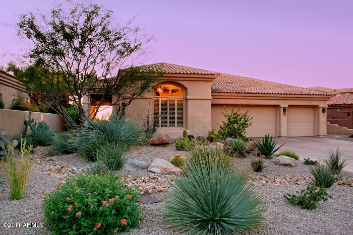 11059 East Turnberry Road Scottsdale, AZ 85255 - Photo 28 of 35 a front view of a house with a yard