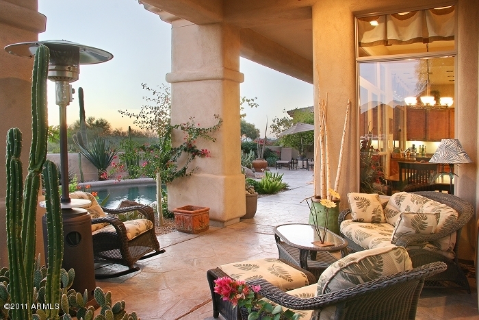 11059 East Turnberry Road Scottsdale, AZ 85255 - Photo 4 of 35 a balcony with couple of chairs and a potted plant