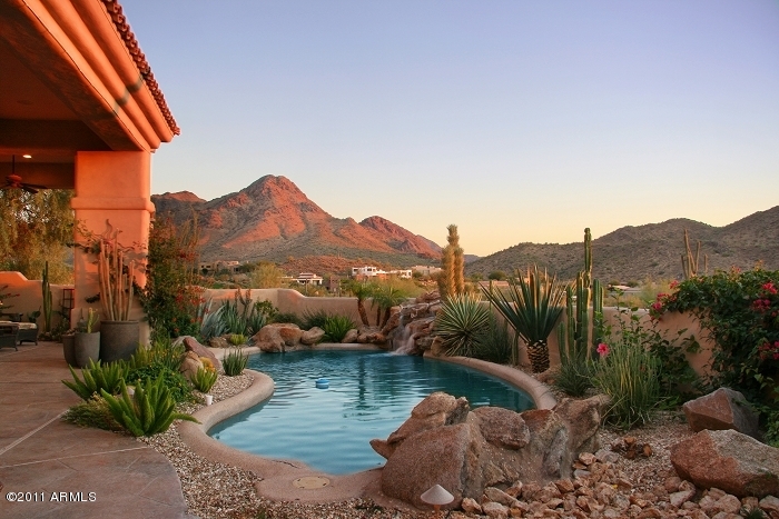 11059 East Turnberry Road Scottsdale, AZ 85255 - Photo 6 of 35 a view of a lake with a mountain in the background