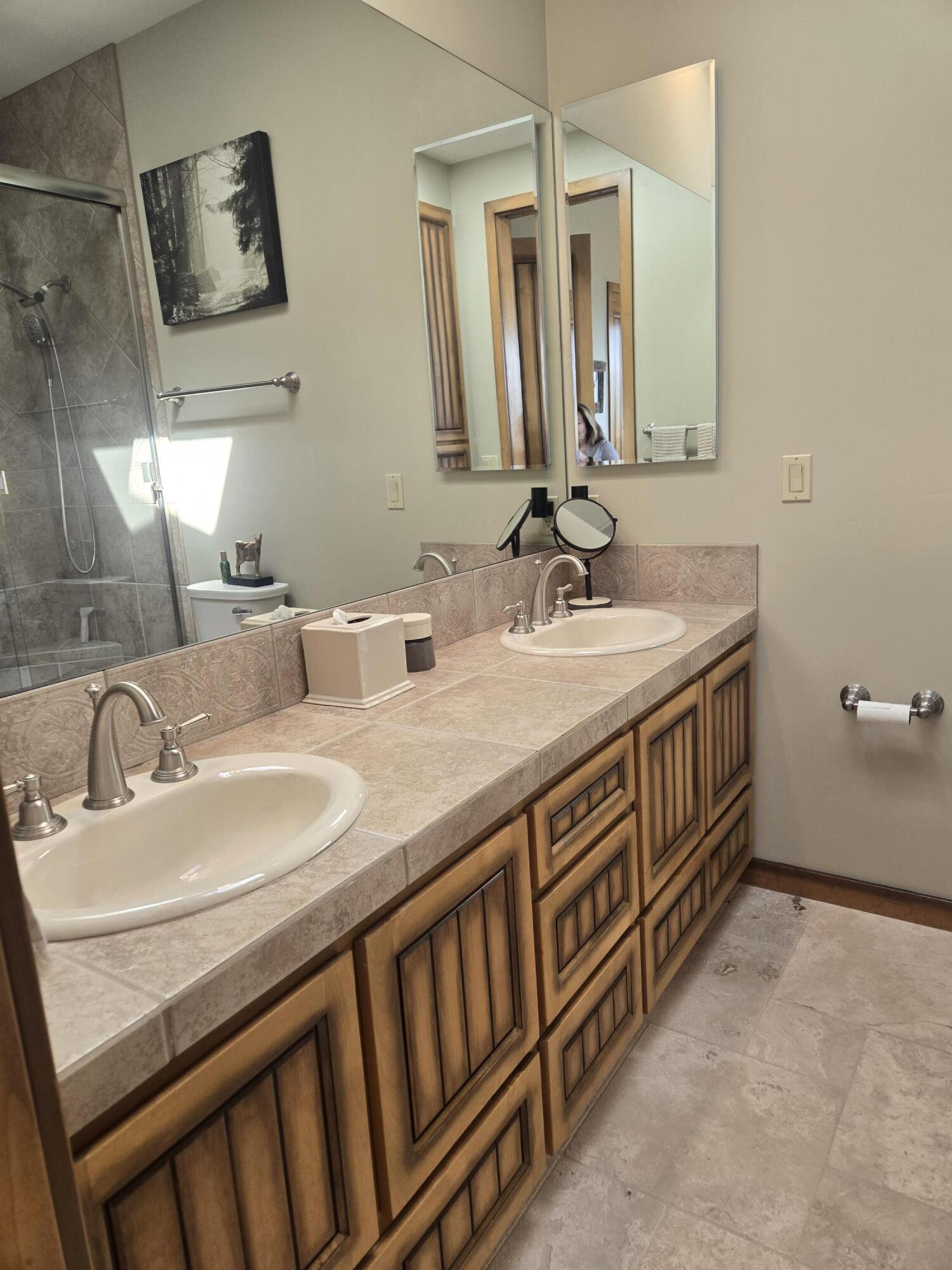 2908 East Rim Club Drive Payson, AZ 85541 - Photo 25 of 77 a bathroom with a double vanity sink and a mirror
