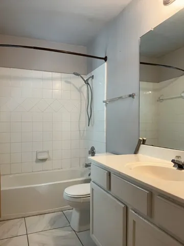 a bathroom with a sink a toilet and a bathtub
