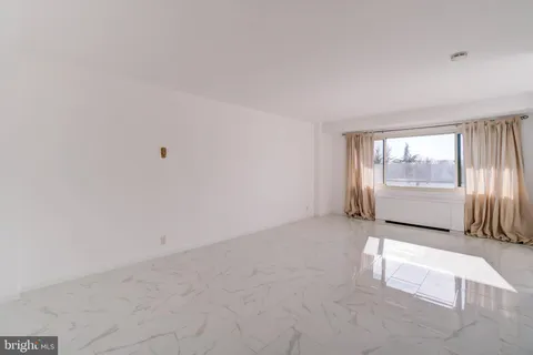 a view of a hallway with an empty room