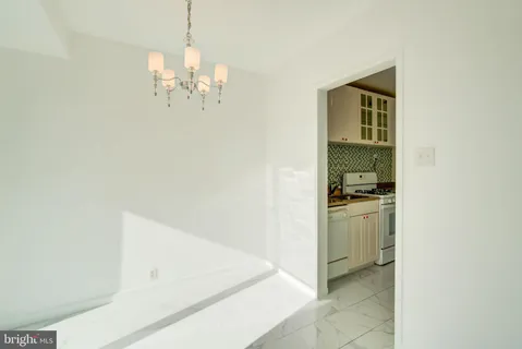 a kitchen with granite countertop a sink and a stove
