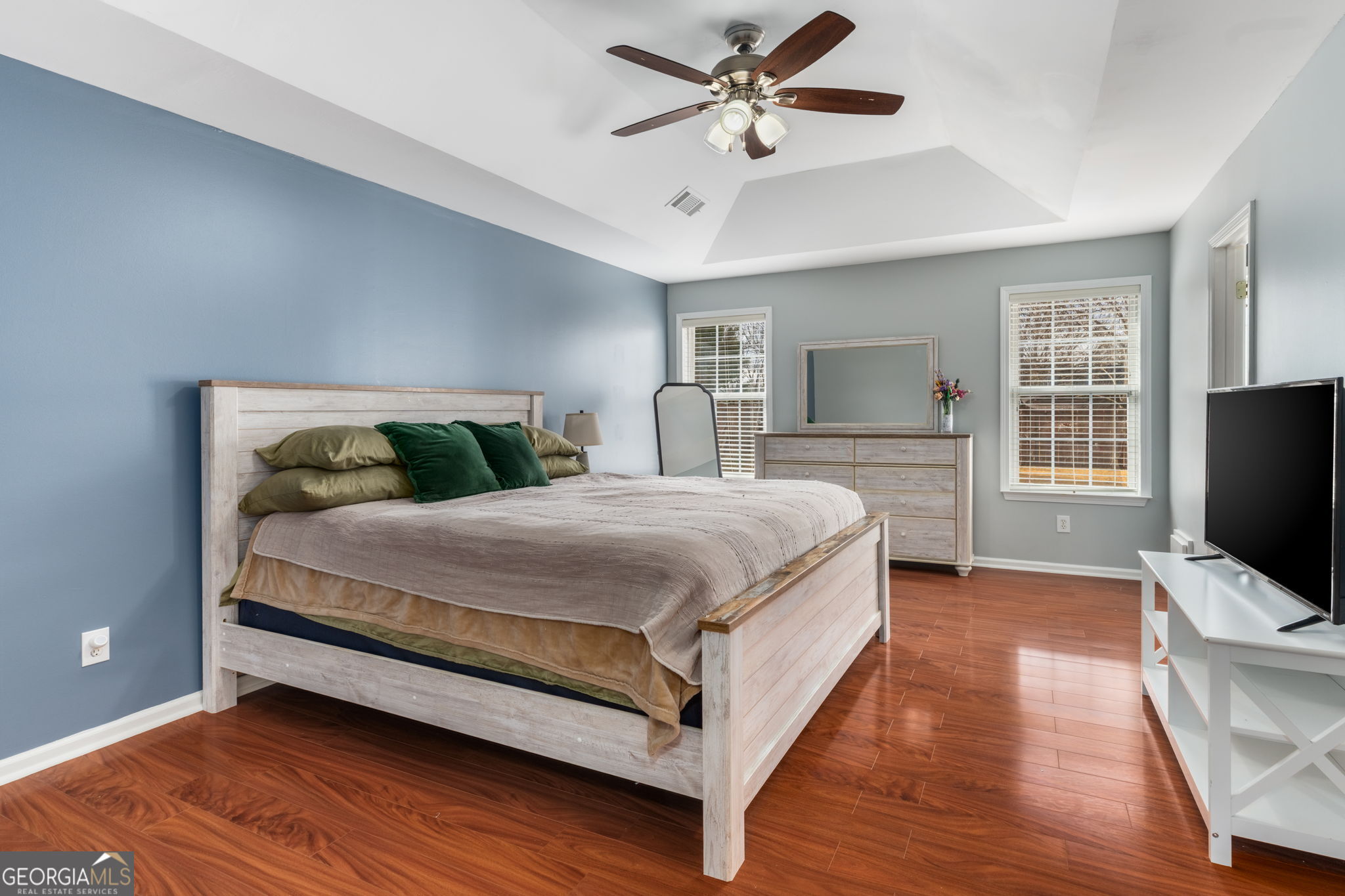 113 Hummingbird Lane Kathleen, GA 31047 - Photo 12 of 44 a bedroom with a bed and wooden floor