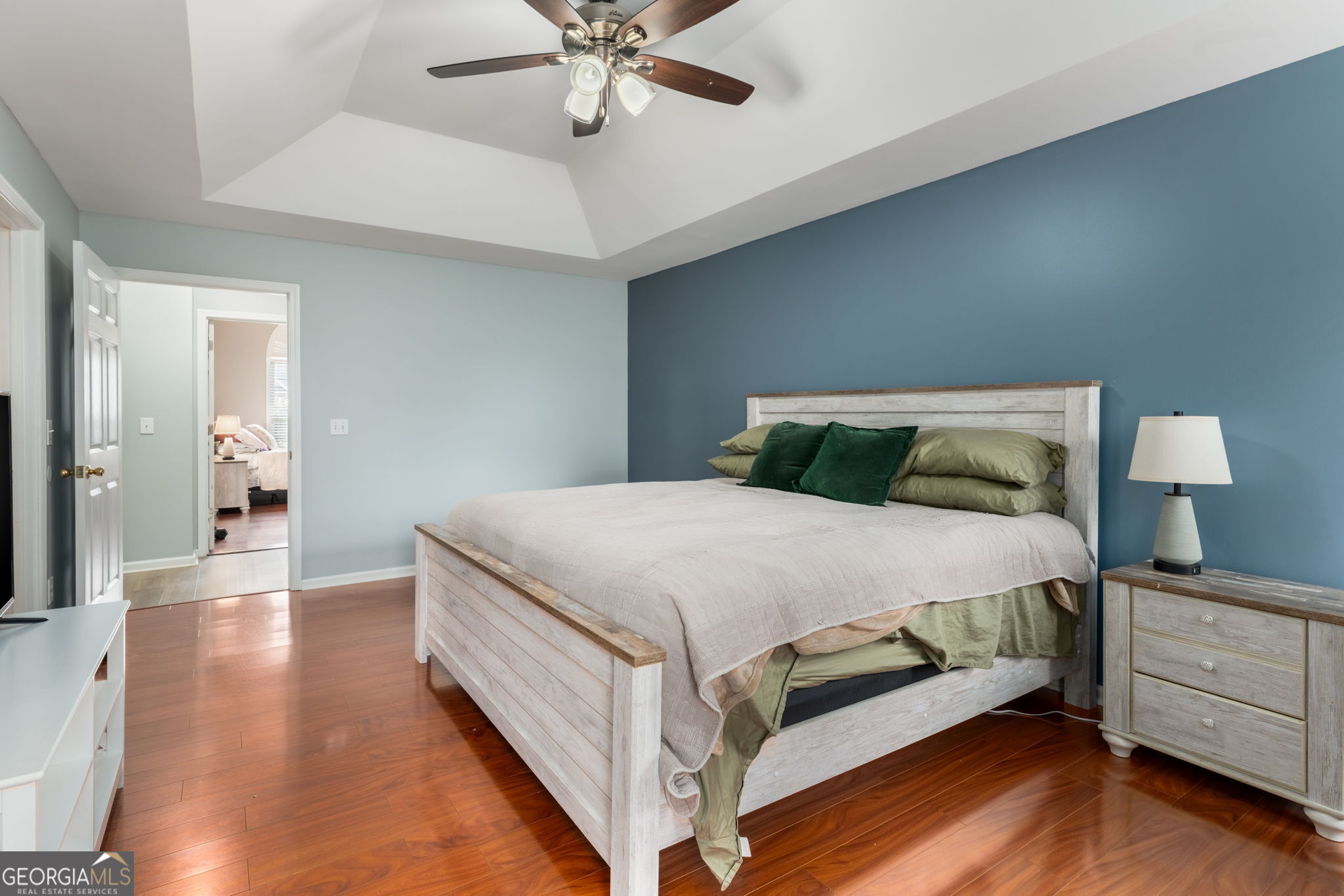 113 Hummingbird Lane Kathleen, GA 31047 - Photo 13 of 44 a bedroom with a bed and a chandelier