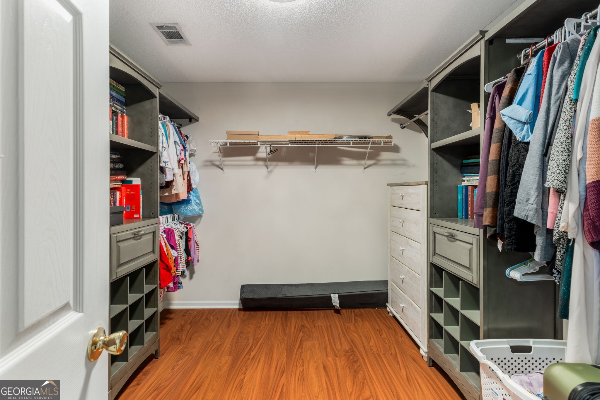113 Hummingbird Lane Kathleen, GA 31047 - Photo 17 of 44 a view of walk in closet with clothes and shoes