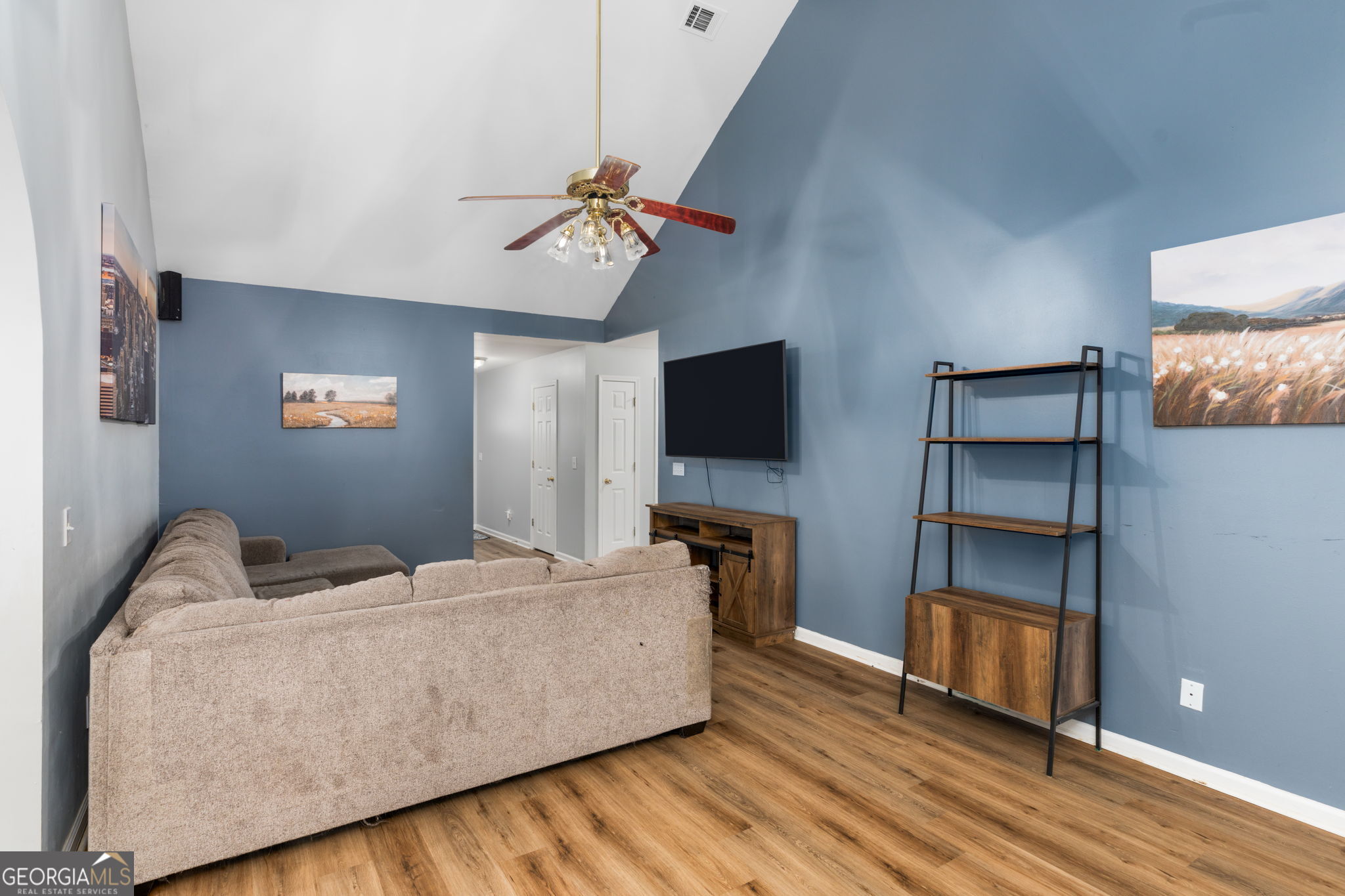 113 Hummingbird Lane Kathleen, GA 31047 - Photo 19 of 44 a living room with furniture and a flat screen tv