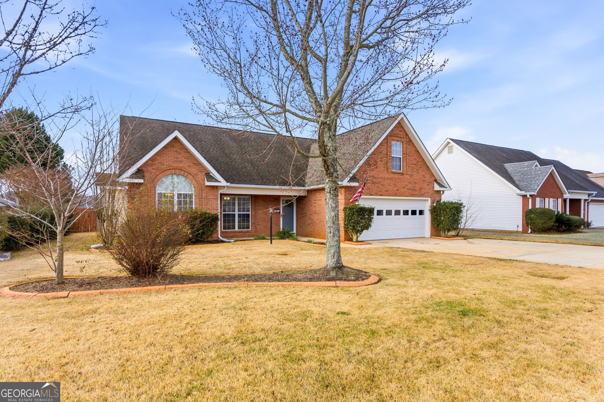 113 Hummingbird Lane Kathleen, GA 31047 - Photo 2 of 44 a front view of a house with a yard
