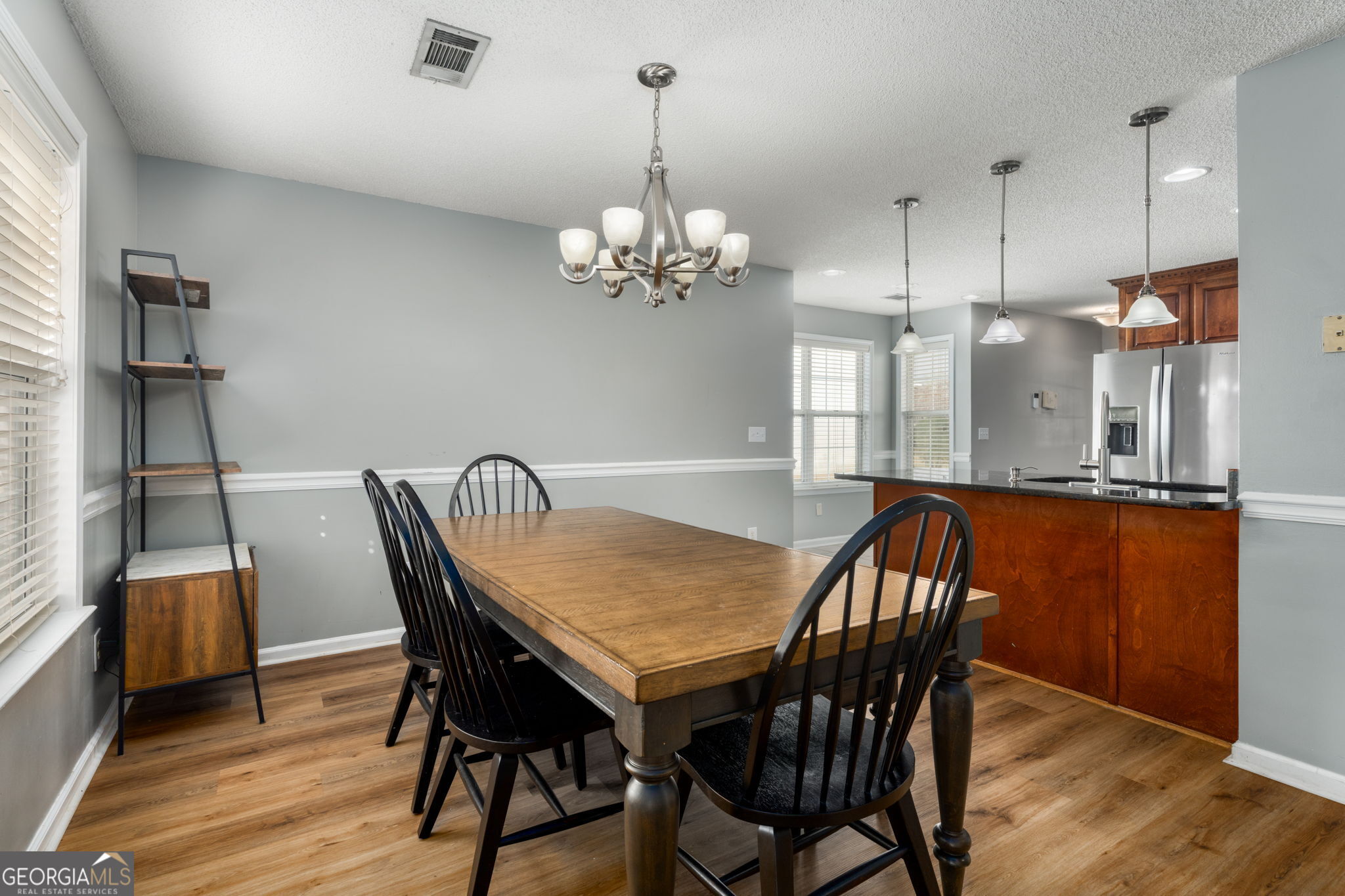 113 Hummingbird Lane Kathleen, GA 31047 - Photo 23 of 44 a dining room with furniture a chandelier and wooden floor