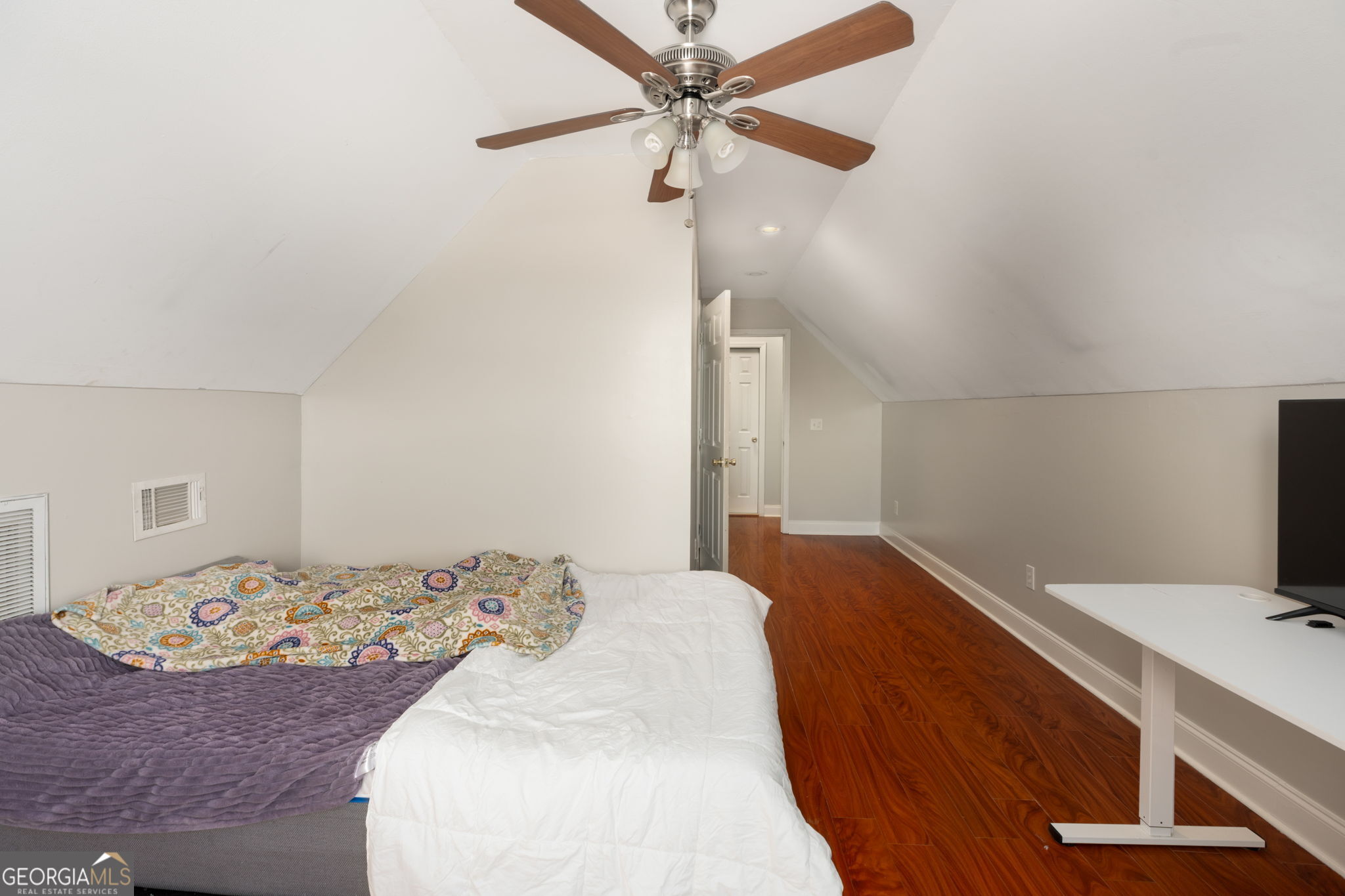 113 Hummingbird Lane Kathleen, GA 31047 - Photo 33 of 44 a bedroom with a bed and a chandelier