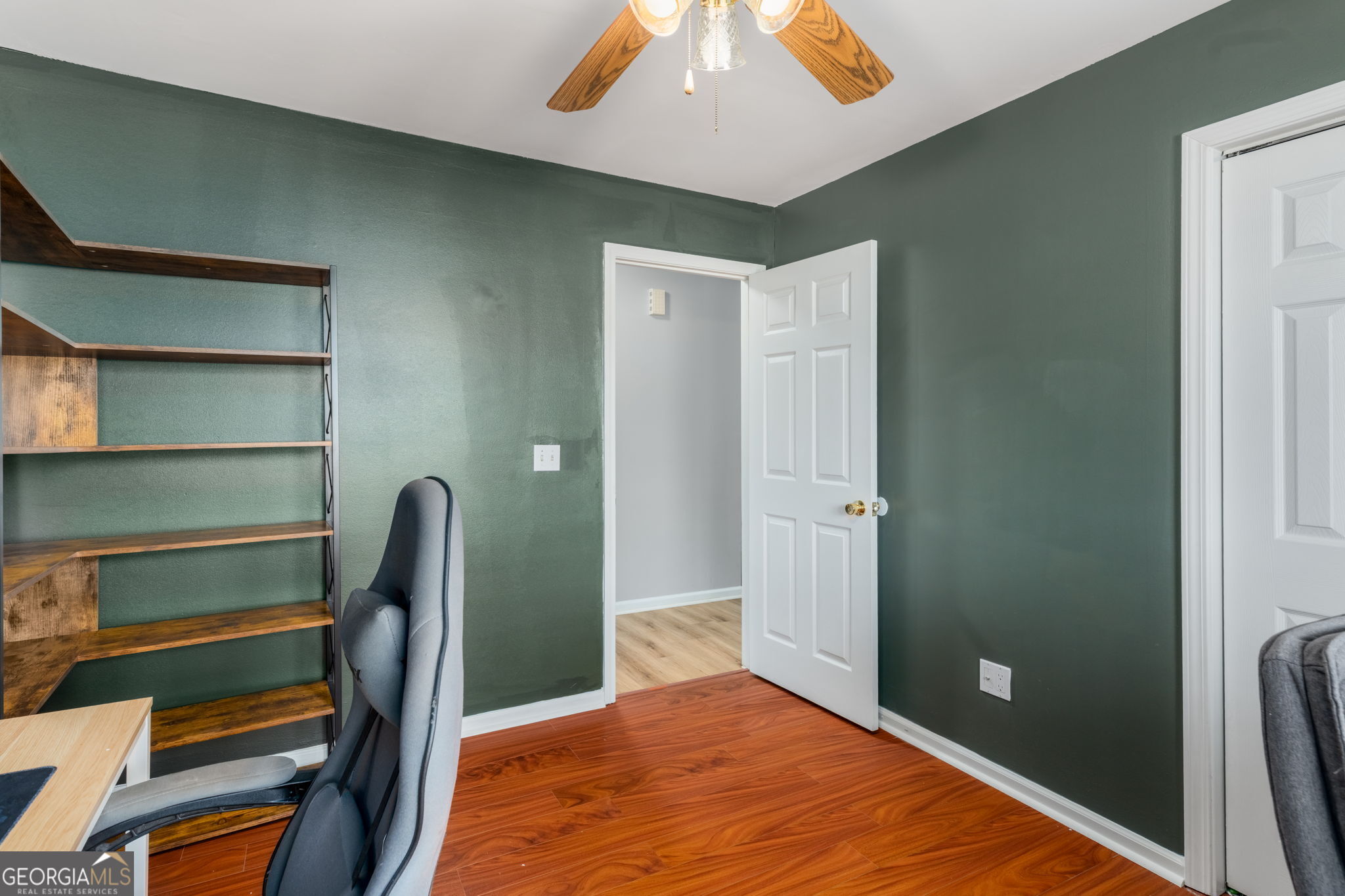 113 Hummingbird Lane Kathleen, GA 31047 - Photo 8 of 44 a bedroom with a bed and a chandelier