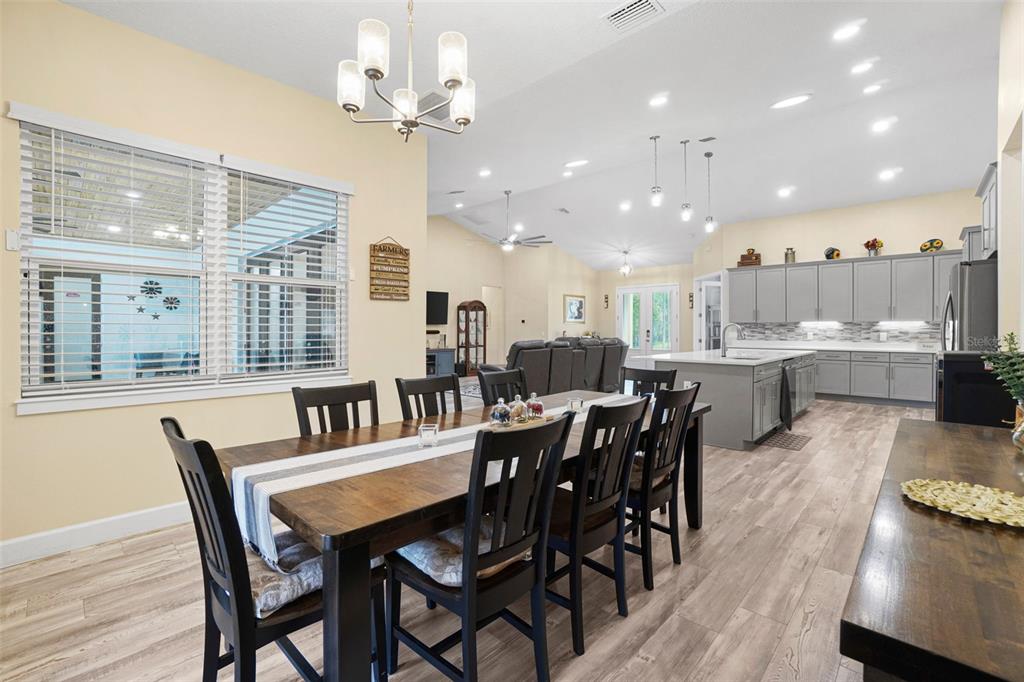 3230 Pheasant Trail Mims, FL 32754 - Photo 17 of 71 a view of a dining room with furniture window and wooden floor