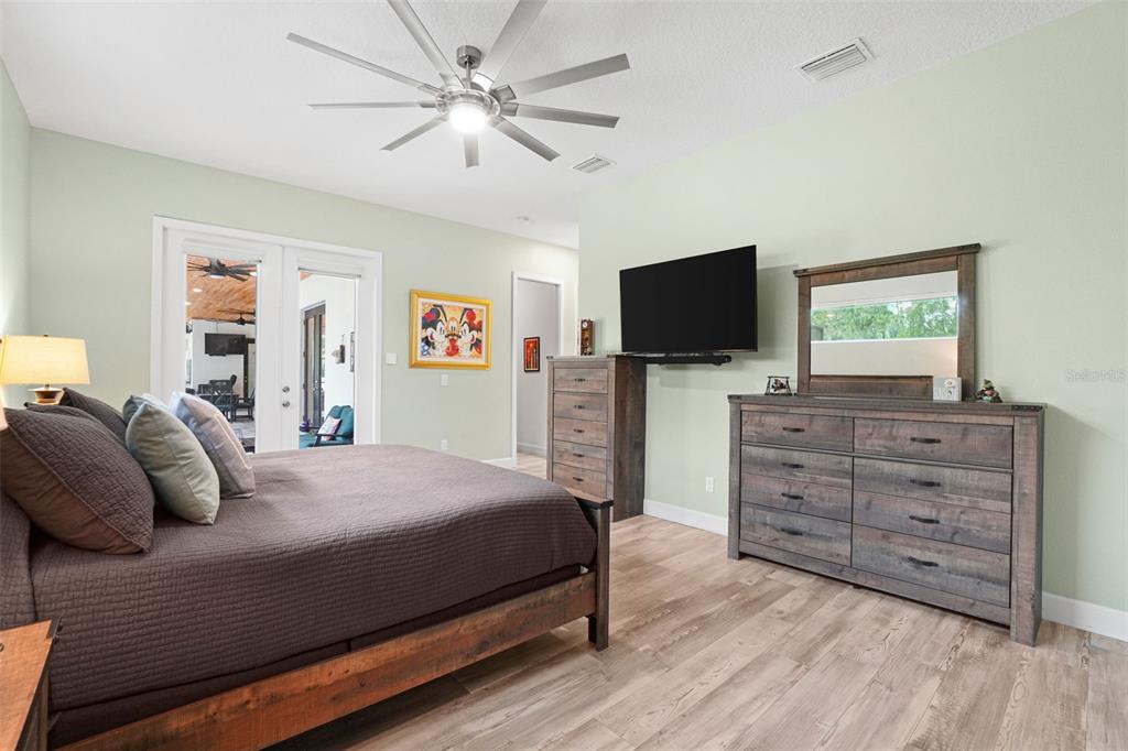 3230 Pheasant Trail Mims, FL 32754 - Photo 22 of 71 a bedroom with a bed and a flat screen tv