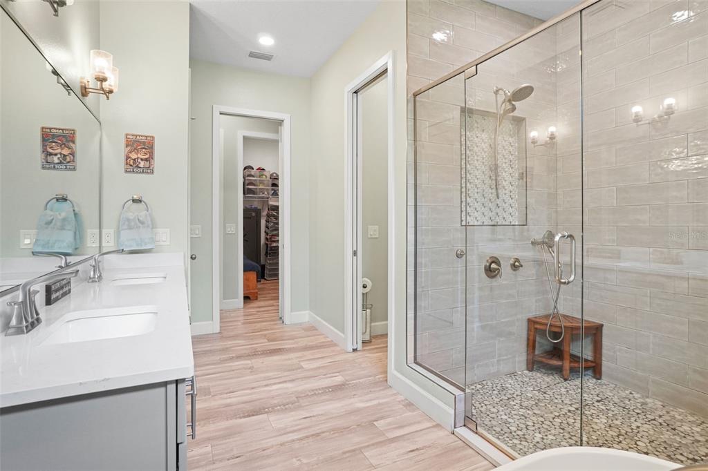 3230 Pheasant Trail Mims, FL 32754 - Photo 25 of 71 a bathroom with a sink a toilet and shower