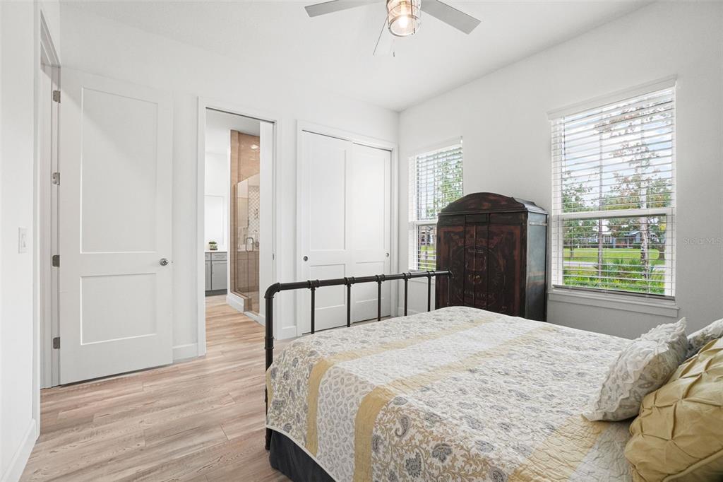 3230 Pheasant Trail Mims, FL 32754 - Photo 28 of 71 a bedroom with a bed and a window