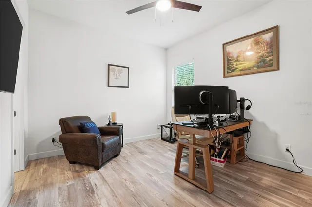 a view of a livingroom with furniture and a flat screen tv