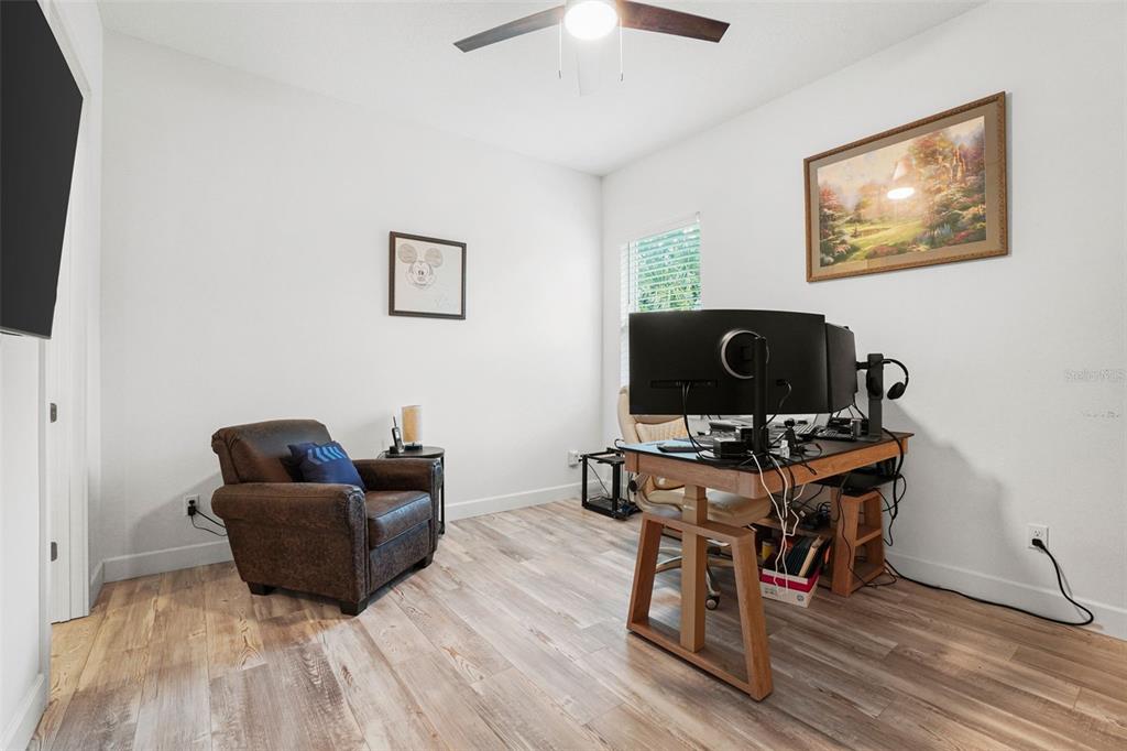 3230 Pheasant Trail Mims, FL 32754 - Photo 31 of 71 a living room with furniture and a flat screen tv