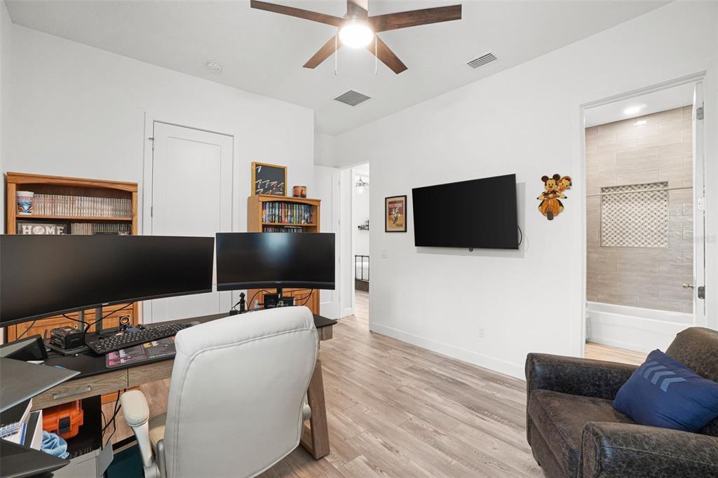 3230 Pheasant Trail Mims, FL 32754 - Photo 32 of 71 a living room with furniture and a flat screen tv