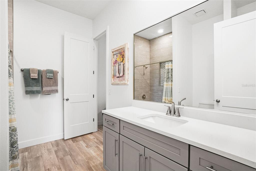 3230 Pheasant Trail Mims, FL 32754 - Photo 33 of 71 a bathroom with a sink and a mirror