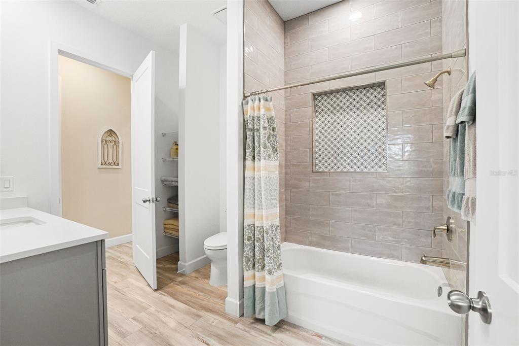 3230 Pheasant Trail Mims, FL 32754 - Photo 34 of 71 a bathroom with a bathtub and a shower