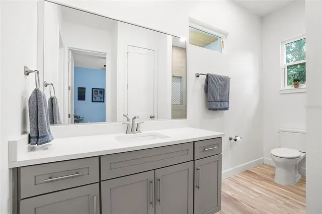 a view of swimming pool with a lounge chairs