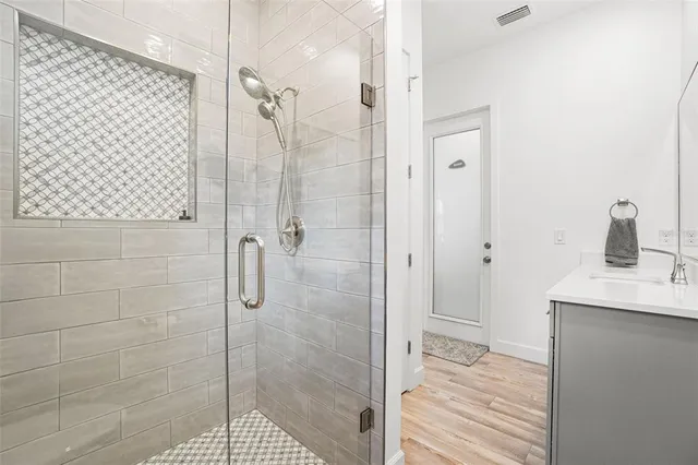 a view of a house with a backyard and a patio